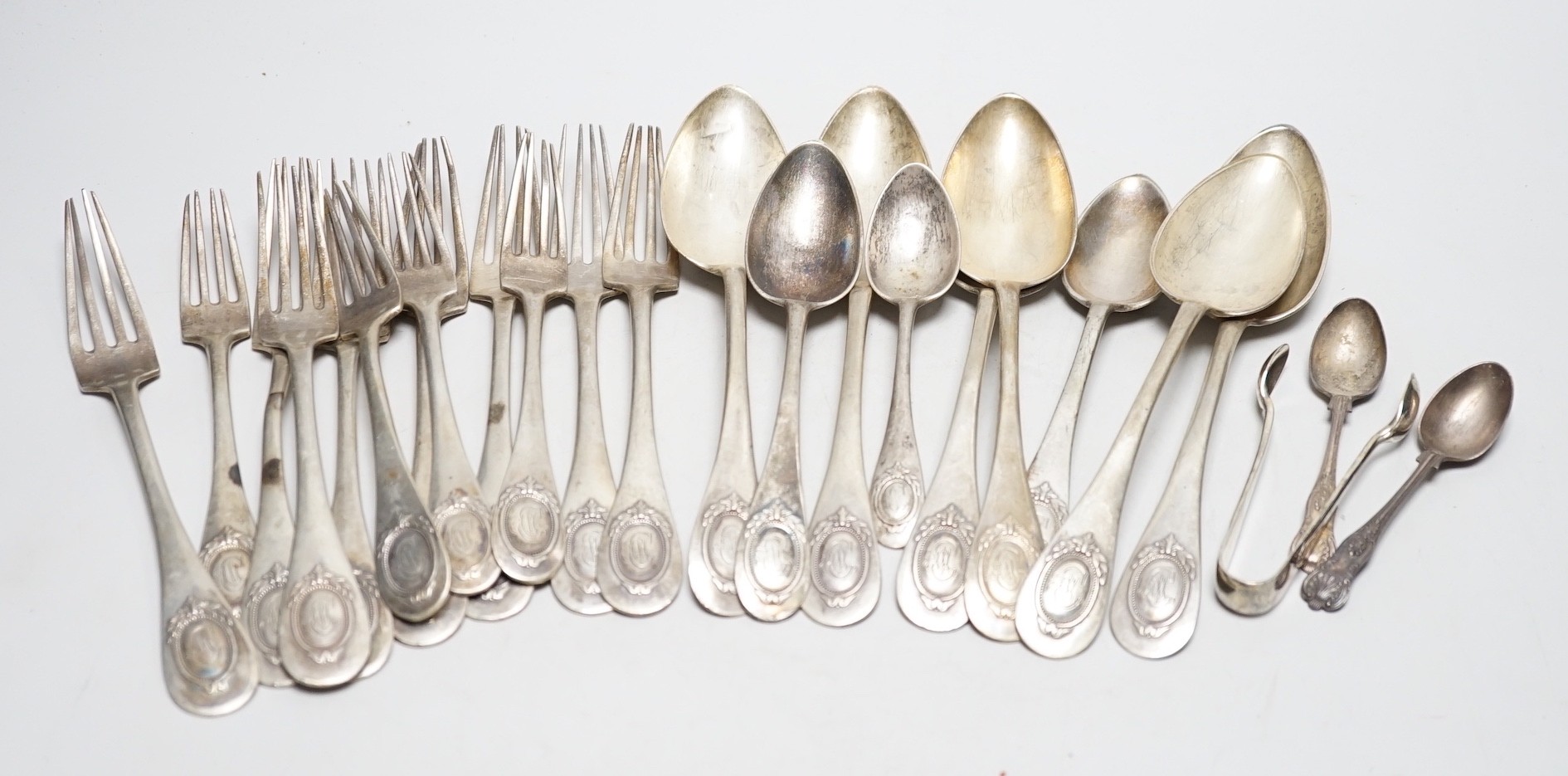 Twenty assorted items of German 800 standard white metal cutlery and three English silver items of cutlery, 39.1oz.